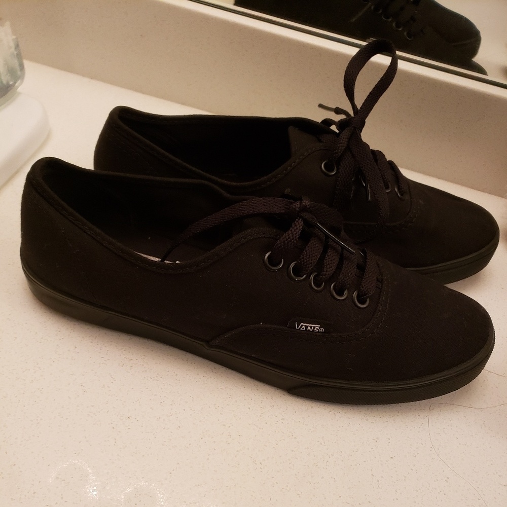 All black low top vans